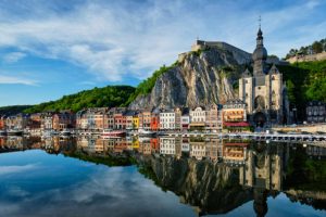 View of picturesque Dinant town, Dinant Citadel and Collegiate Church of Notre Dame de Dinant over the Meuse river. Belgian province of Namur, Blegium
